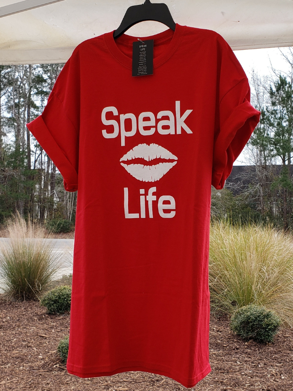 Red Speak Life T-shirt with Lips design, Size XL in GEM Designs' Booth at 619 Trolley Rd, Summerville, SC inside Antiques & Artisans room with the large Christmas tree. 