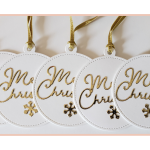 Handmade round gift tag with Merry Christmas in gold accented by a cute gold snowflake.