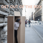 A woman stepping out of the box.