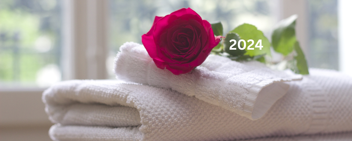 Self-care is a priority. This picture is of a rose and towels ready and waiting for you to wind down and relax.