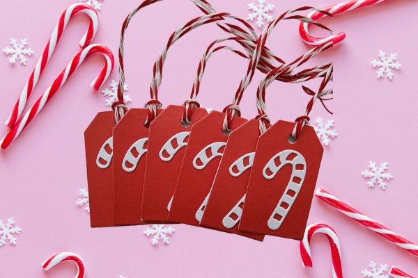 Handmade candy cane hang tags also known as gift tags red background with white candy cane