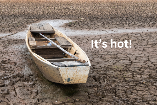 picture of a boat with dried up sand. It could be a drought