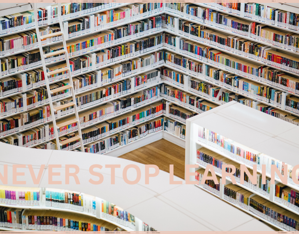 Picture of books in a library with the words never stop learning