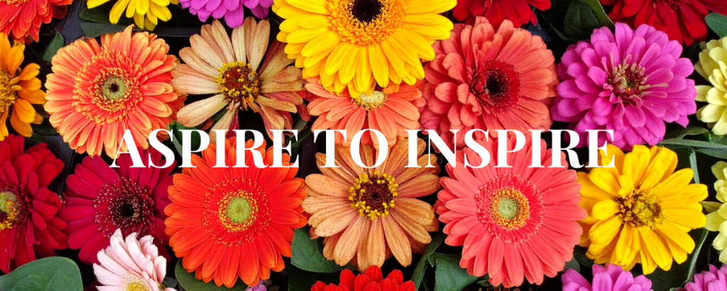 Gerbera Daisies with the words Aspire to Inspire