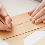 Woman writing on a notecard