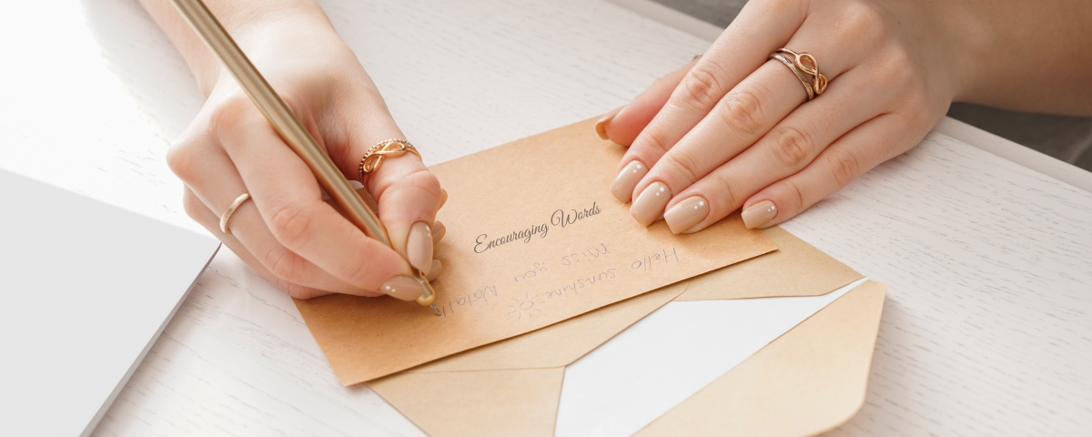 Woman writing on a notecard